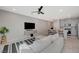 This living room showcases an open floor plan that connects the kitchen and dining area, perfect for gatherings at 5269 Silver Branch Ave, Las Vegas, NV 89118