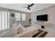 Modern living room with a comfortable sofa, large windows, and stylish decor at 5269 Silver Branch Ave, Las Vegas, NV 89118