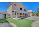 Backyard with shed, covered patio, and artificial turf at 534 Rancho Del Mar Way, North Las Vegas, NV 89031