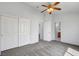 Bedroom features gray carpet, ceiling fan, and closet at 534 Rancho Del Mar Way, North Las Vegas, NV 89031