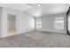Spacious bedroom with plush carpeting, large windows, and ensuite bathroom entrance, offering a serene retreat at 534 Rancho Del Mar Way, North Las Vegas, NV 89031