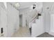 Bright foyer featuring tiled entry, modern carpet, and curved staircase at 534 Rancho Del Mar Way, North Las Vegas, NV 89031