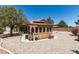 Wide view of charming backyard, featuring desert landscaping and unique gazebo at 5405 Lucky Clover St, Las Vegas, NV 89149