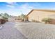 Large backyard featuring gravel landscaping, mature plants, and a charming cabana at 5405 Lucky Clover St, Las Vegas, NV 89149