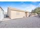 Gravel backyard with a charming gazebo and an extended covered patio area at 5405 Lucky Clover St, Las Vegas, NV 89149