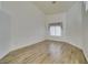 Bright bedroom with hardwood flooring and a large window providing natural light at 5405 Lucky Clover St, Las Vegas, NV 89149