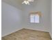 Bright bedroom with vaulted ceilings, wood-look floors and a large window at 5405 Lucky Clover St, Las Vegas, NV 89149