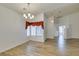Dining room with hardwood flooring, modern chandelier, and natural light at 5405 Lucky Clover St, Las Vegas, NV 89149
