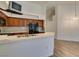 Kitchen area with stainless steel appliances, white countertops, and wood cabinets at 5405 Lucky Clover St, Las Vegas, NV 89149
