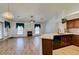 Living room with fireplace, kitchen, and modern wood floors at 5405 Lucky Clover St, Las Vegas, NV 89149
