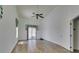Living room with high ceiling, wood-look flooring and a sliding glass door at 5405 Lucky Clover St, Las Vegas, NV 89149
