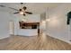 Open floor plan connecting living room and kitchen with modern wood floors at 5405 Lucky Clover St, Las Vegas, NV 89149