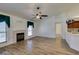 Open living room with fireplace and modern wood floors at 5405 Lucky Clover St, Las Vegas, NV 89149