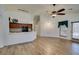 Spacious living room view showing an open layout to kitchen area with wood floors at 5405 Lucky Clover St, Las Vegas, NV 89149