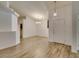 Spacious open-concept living room with hardwood floors, modern lighting, and a bright, airy feel at 5405 Lucky Clover St, Las Vegas, NV 89149