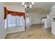 Bright living room featuring hardwood floors, ample natural light, and modern light fixtures at 5405 Lucky Clover St, Las Vegas, NV 89149