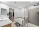 Bathroom featuring a soaking tub and glass-enclosed shower at 5631 Hill Cliff Ct, North Las Vegas, NV 89031