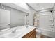 Bathroom featuring double sinks, large mirror, and a shower-tub combination at 5631 Hill Cliff Ct, North Las Vegas, NV 89031