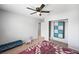 Charming bedroom with unique wall decor, a ceiling fan, and ample space for creative design at 5631 Hill Cliff Ct, North Las Vegas, NV 89031