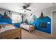 Bright bedroom with two twin beds and unique silhouette wall decor at 5631 Hill Cliff Ct, North Las Vegas, NV 89031