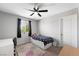 Bedroom with a ceiling fan and window with backyard view at 5631 Hill Cliff Ct, North Las Vegas, NV 89031