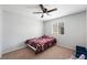 Neutral bedroom with ceiling fan, window, and plush carpet at 5631 Hill Cliff Ct, North Las Vegas, NV 89031