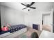 Bedroom with a ceiling fan and window with backyard view at 5631 Hill Cliff Ct, North Las Vegas, NV 89031