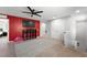 Bright bonus room with a TV, ceiling fan, and neutral carpet at 5631 Hill Cliff Ct, North Las Vegas, NV 89031