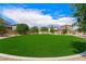 Beautifully landscaped common area featuring green grass and a cozy gazebo at 5631 Hill Cliff Ct, North Las Vegas, NV 89031