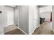 Hallway featuring flooring and doorways to rooms on either side at 5631 Hill Cliff Ct, North Las Vegas, NV 89031
