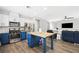 Spacious kitchen with a wooden center island and open layout to the living area at 5631 Hill Cliff Ct, North Las Vegas, NV 89031