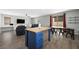 Kitchen with center island and seating which opens up to the living room at 5631 Hill Cliff Ct, North Las Vegas, NV 89031