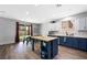 Kitchen with center island, modern appliances and backyard access at 5631 Hill Cliff Ct, North Las Vegas, NV 89031