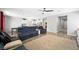 Open concept living room with view of kitchen, ceiling fan and backyard access at 5631 Hill Cliff Ct, North Las Vegas, NV 89031