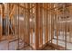 An unfinished bathroom displays the basic wooden framework, pre-installed plumbing, and under-slab drain lines at 5855 St Ebbes Ct, Las Vegas, NV 89131