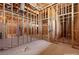 Unfinished bedroom with exposed wood framing, ductwork, and concrete flooring at 5855 St Ebbes Ct, Las Vegas, NV 89131
