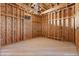 A second unfinished bedroom exhibits wooden framing, plywood walls, and a sloped ceiling with a pre-installed ventilation system at 5855 St Ebbes Ct, Las Vegas, NV 89131