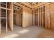 An unfinished bedroom featuring wood framing, awaiting completion with visible wiring and structural details at 5855 St Ebbes Ct, Las Vegas, NV 89131