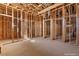 A third unfinished bedroom under construction shows wooden framing and ventilation ducts with unfinished concrete floors at 5855 St Ebbes Ct, Las Vegas, NV 89131