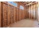 The closet is under construction and highlights wooden framing and a pre-planned layout, with a small window bringing in natural light at 5855 St Ebbes Ct, Las Vegas, NV 89131
