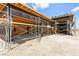 Exterior view of a house under construction with scaffolding and black moisture barrier at 5855 St Ebbes Ct, Las Vegas, NV 89131