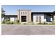 Modern home displaying a minimalist facade with clean lines and desert landscaping at 5855 St Ebbes Ct, Las Vegas, NV 89131