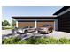Modern multi-car garage featuring sleek doors and ample parking space at 5855 St Ebbes Ct, Las Vegas, NV 89131