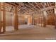 Unfinished home gym featuring exposed framing, ductwork, concrete flooring, and ample space at 5855 St Ebbes Ct, Las Vegas, NV 89131