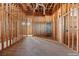 Unfinished kitchen showcasing wood framing, plywood walls, and exposed ceiling in a new home build at 5855 St Ebbes Ct, Las Vegas, NV 89131