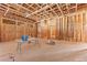 Unfinished kitchen showcasing wood framing, plywood walls, and exposed ceiling in a new home build at 5855 St Ebbes Ct, Las Vegas, NV 89131