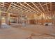 View of the living room under construction, showing the framing and layout of the home at 5855 St Ebbes Ct, Las Vegas, NV 89131