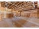 Unfinished living room showcasing wood framing, plywood walls, and exposed ceiling in a new home build at 5855 St Ebbes Ct, Las Vegas, NV 89131