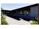 Modern home showcasing a luxurious backyard pool and jacuzzi area at 5855 St Ebbes Ct, Las Vegas, NV 89131