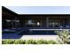 Luxurious backyard pool with lounge chairs, and an umbrella on the pool deck at 5855 St Ebbes Ct, Las Vegas, NV 89131